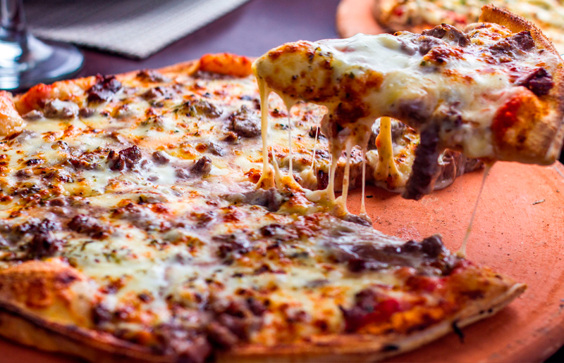 Cupom de desconto - 32% OFF em Pizza Gigante ou Calzone